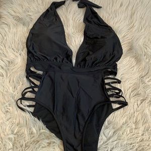 NWT Beach Queen black swim suit. Low cut halter with side cutouts